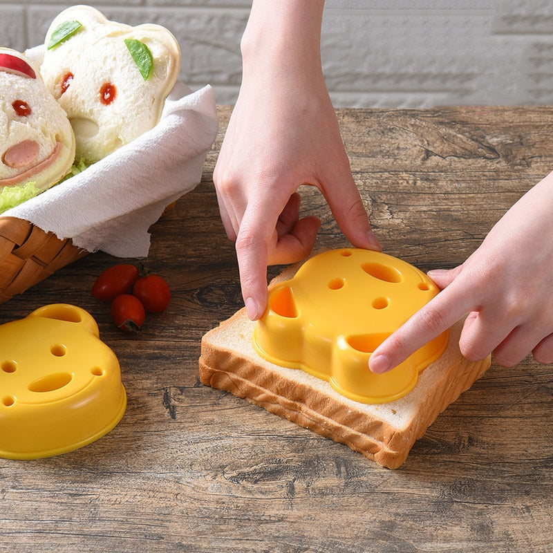 https://www.kitchenswags.com/cdn/shop/products/Cartoon-Cute-Animal-Shape-Sandwich-Bread-Cake-Cookie-Mold-Pastry-Plastic-Embossing-Device-Kitchen-Accessories-Cooking.jpg?v=1667819652